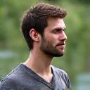 Portrait of Liam, a frequent retreat participant, looking thoughtful.